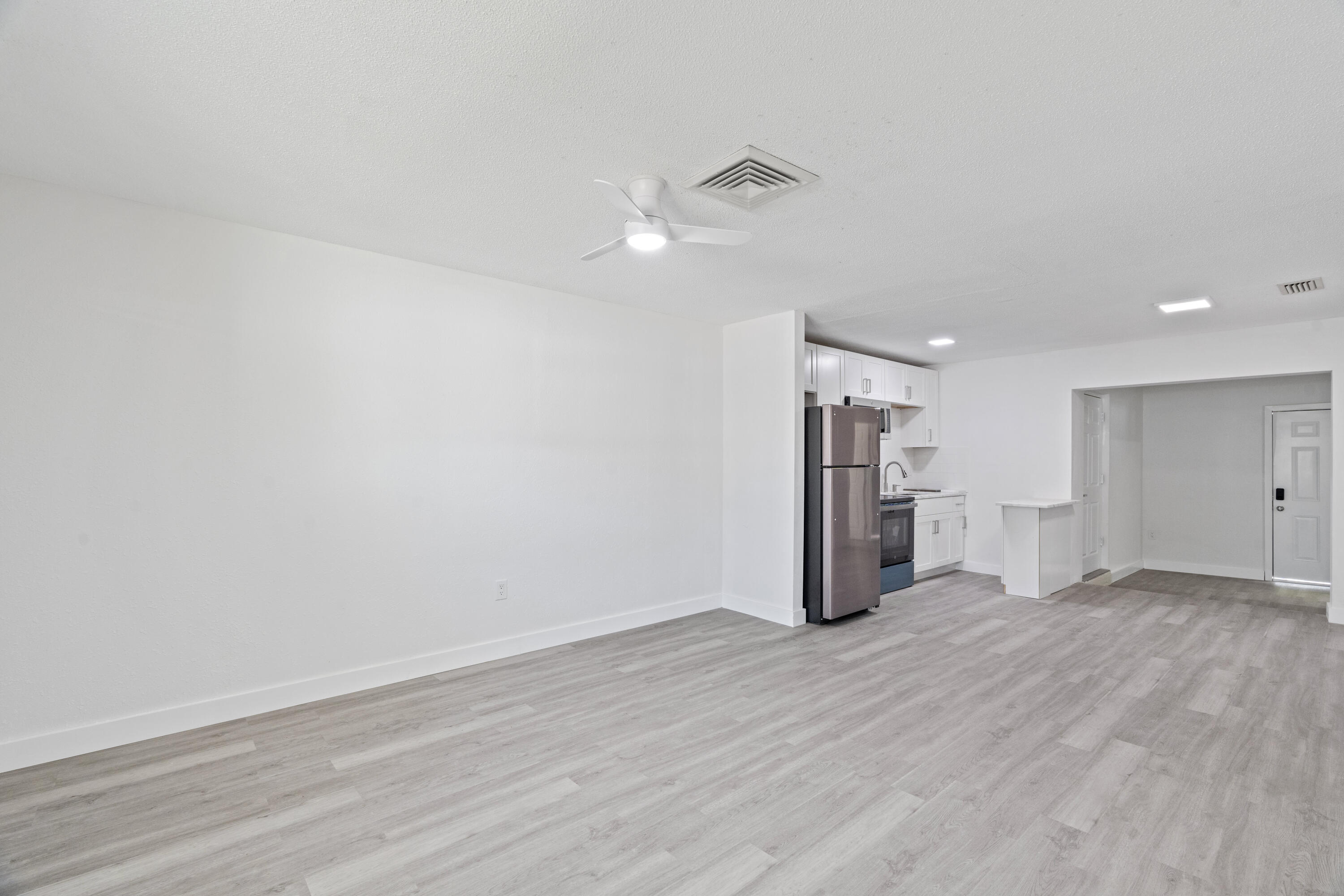 662 Granada Street Fort Pierce, FL 34949 - Photo 36 of 48 a view of empty room with wooden floor