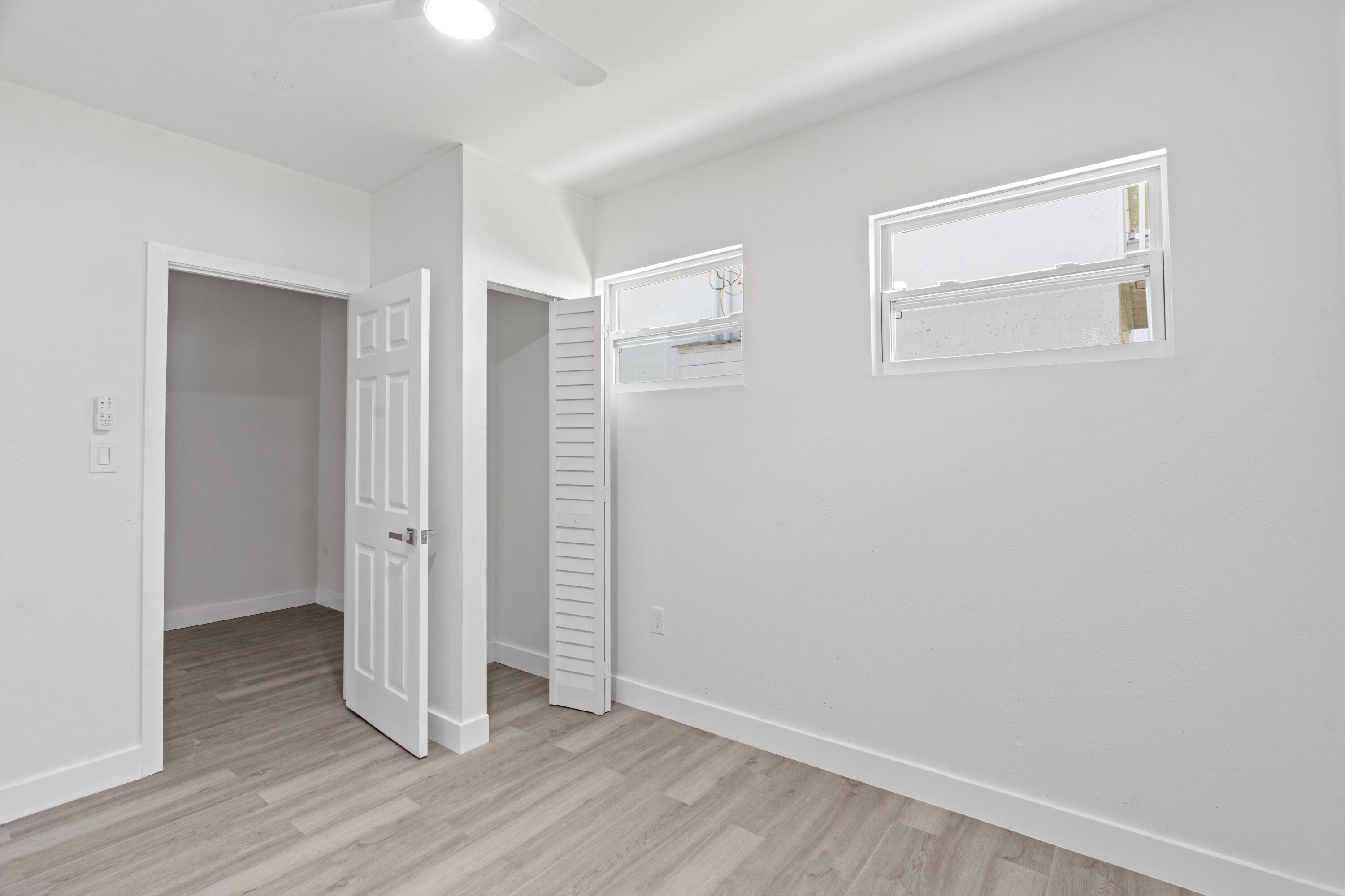 662 Granada Street Fort Pierce, FL 34949 - Photo 42 of 48 a view of an empty room with wooden floor