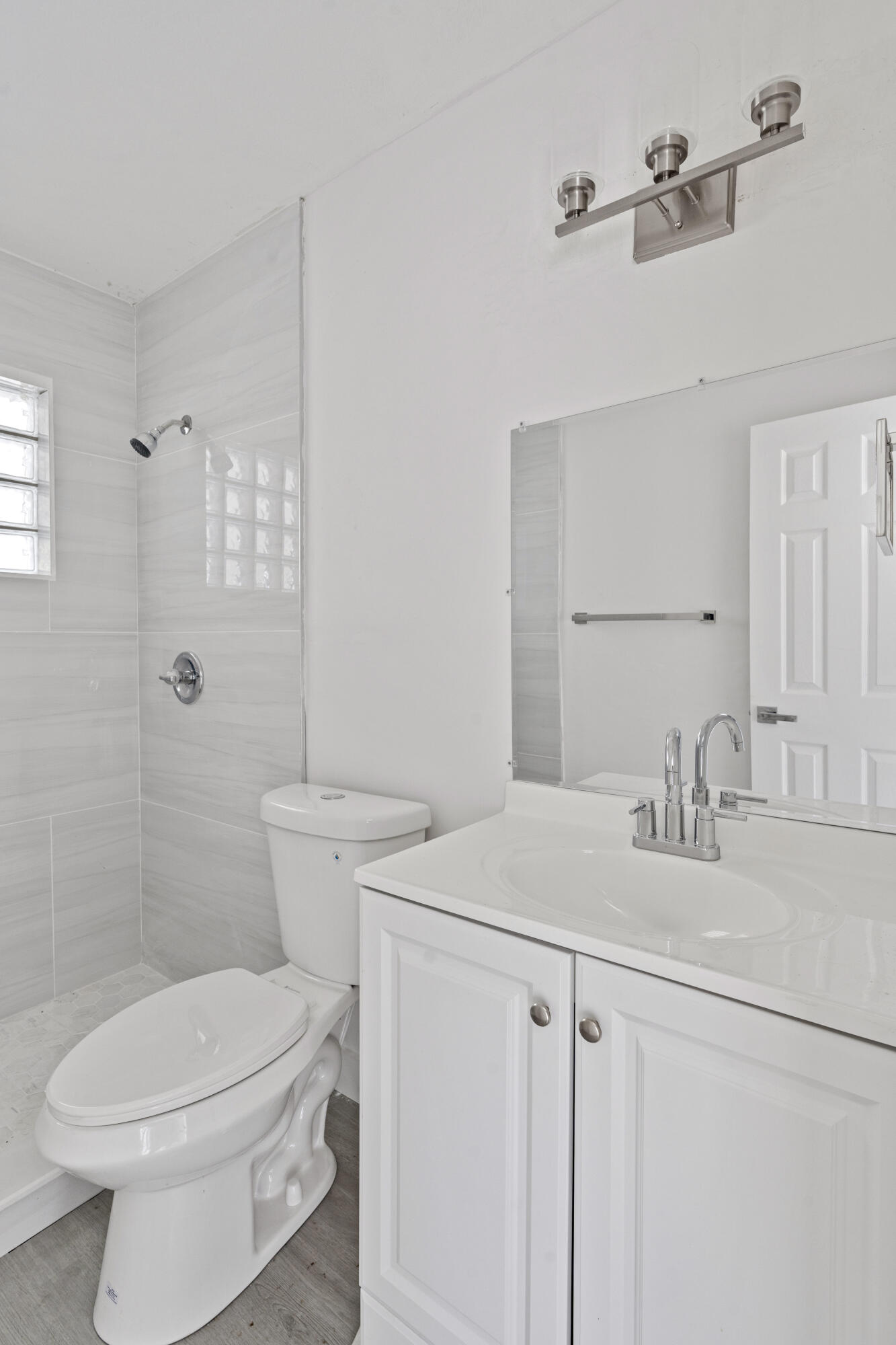 662 Granada Street Fort Pierce, FL 34949 - Photo 48 of 48 a bathroom with a sink a toilet and shower