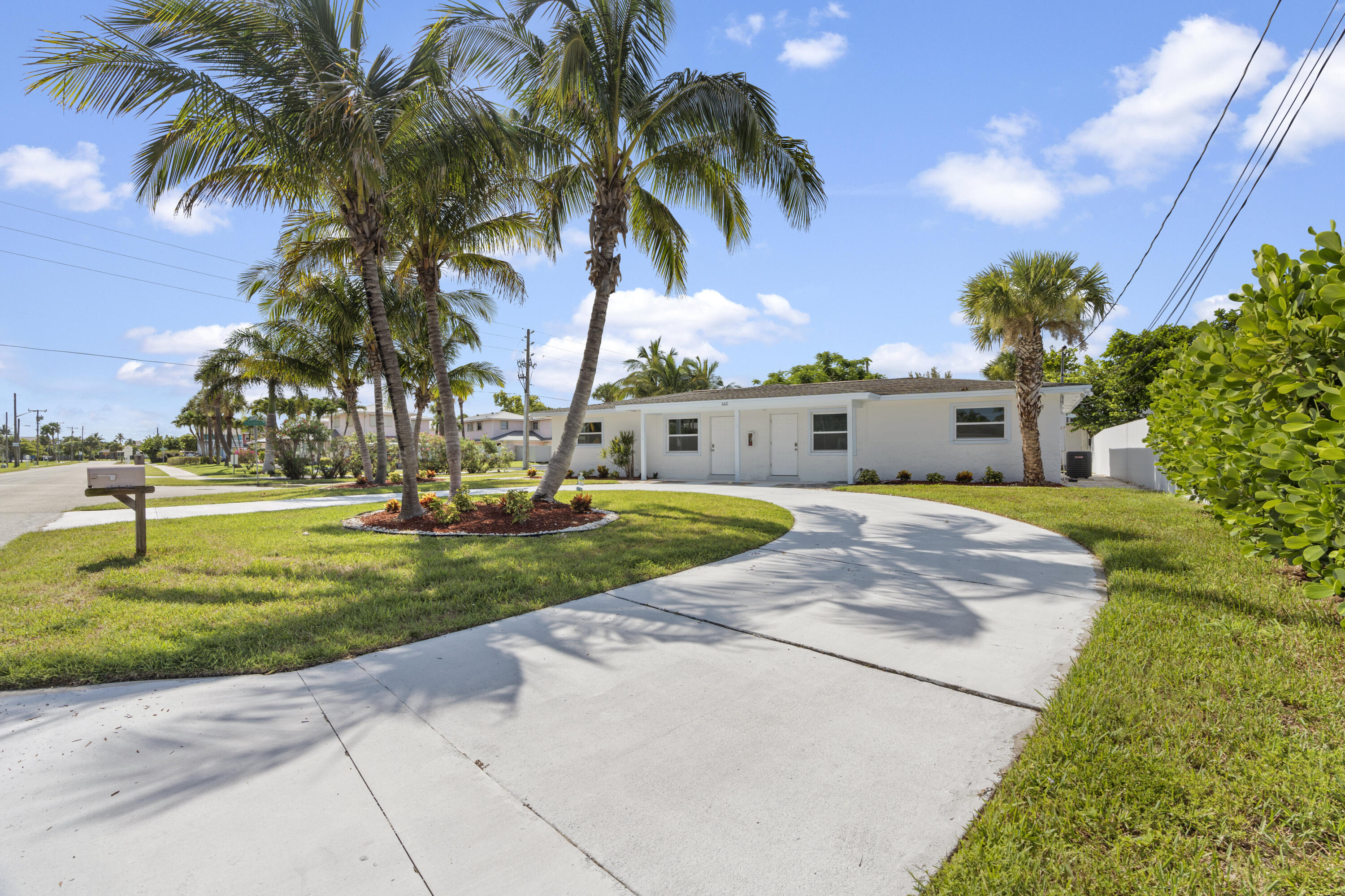 662 Granada Street Fort Pierce, FL 34949 - Photo 9 of 48 a view of a yard with palm trees