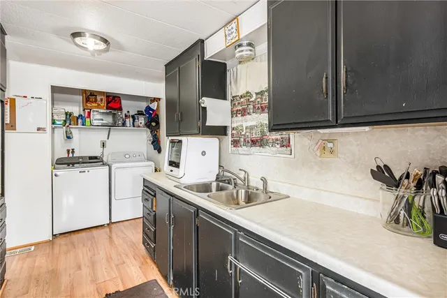 a kitchen with stainless steel appliances granite countertop a stove and a refrigerator