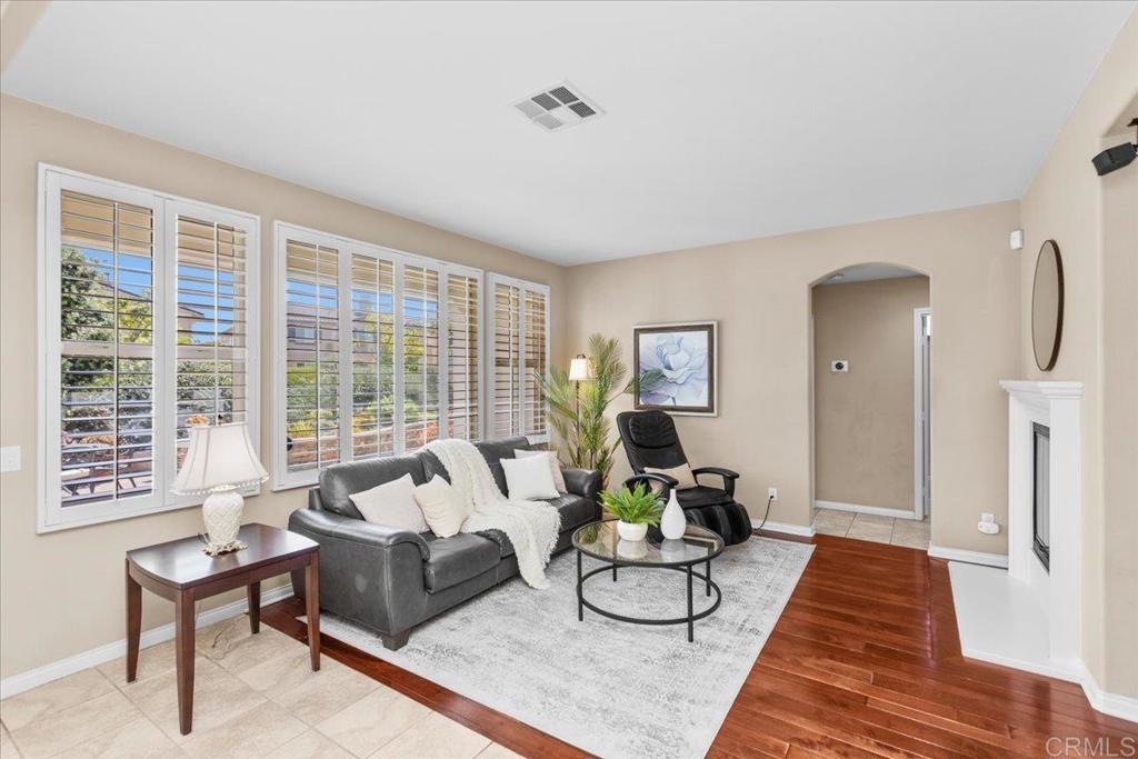 838 Luminara Way San Marcos, CA 92078 - Photo 22 of 54 a living room with furniture and a large window