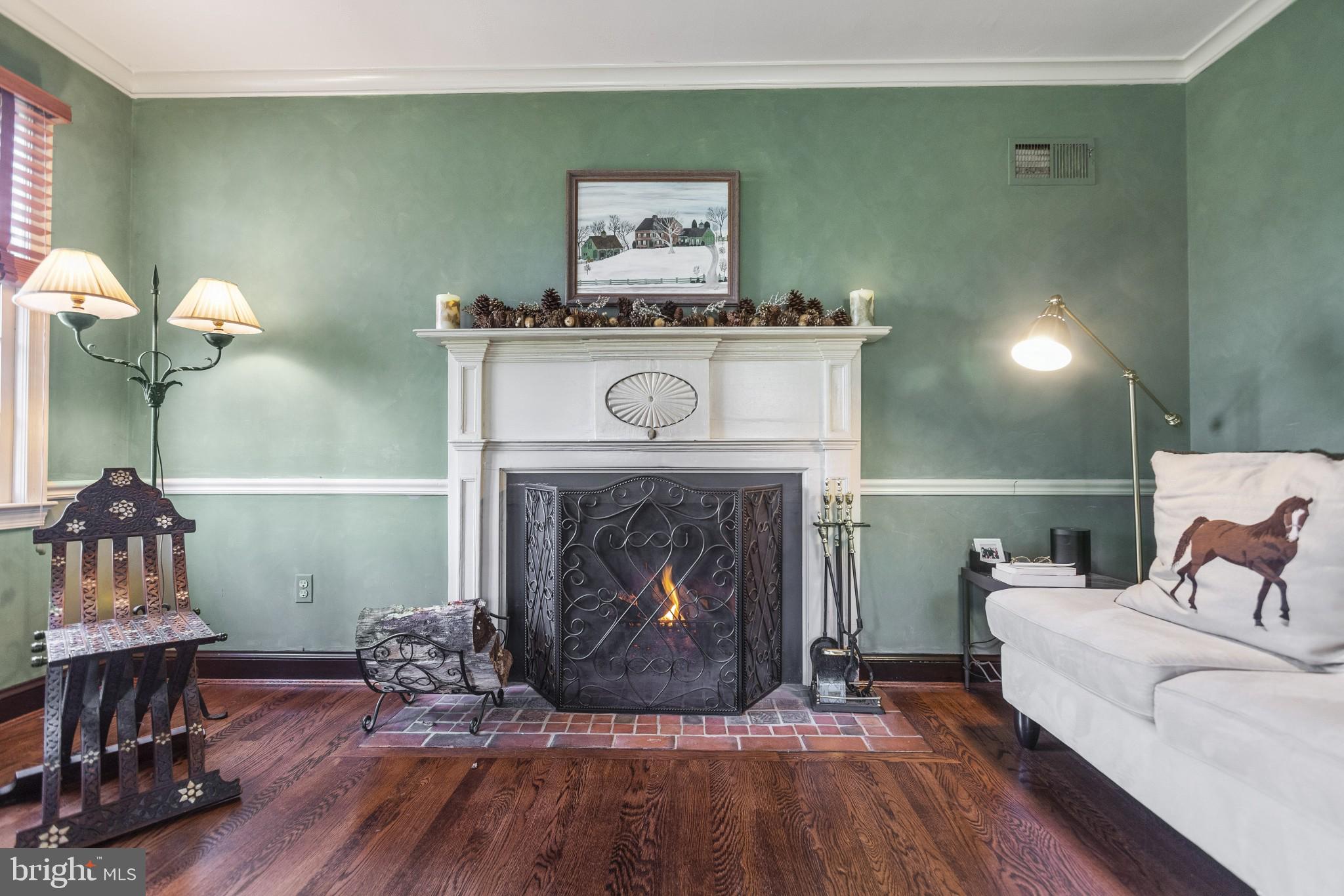 1918 Merrifields Drive Silver Spring, MD 20906 - Photo 10 of 56 Wood burning fireplace in the living room