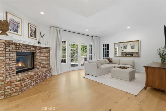 a living room with furniture window and a fireplace