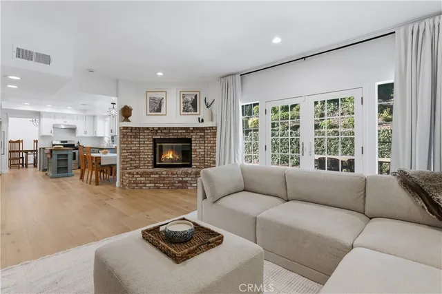 a living room with furniture window and fireplace