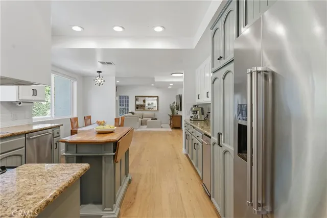 a kitchen with counter top space and refrigerator