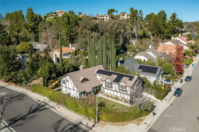 an aerial view of a house having swimming pool