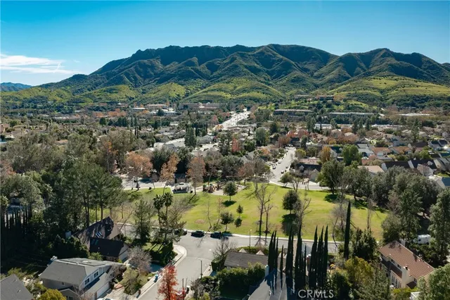an aerial view of residential houses and outdoor space