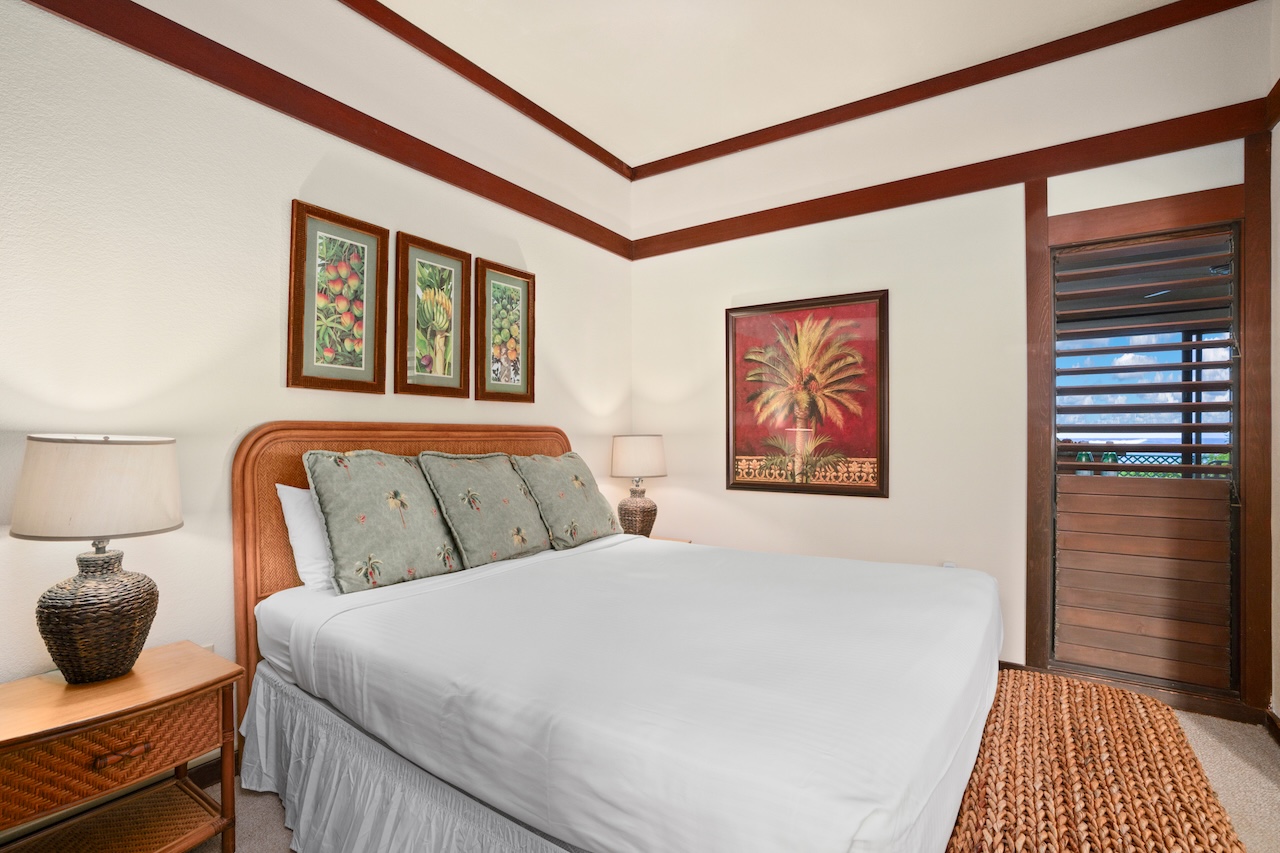 2253 Poipu Road, Unit 192 Koloa, HI 96756 - Photo 19 of 27 a bedroom with a bed and a night stand