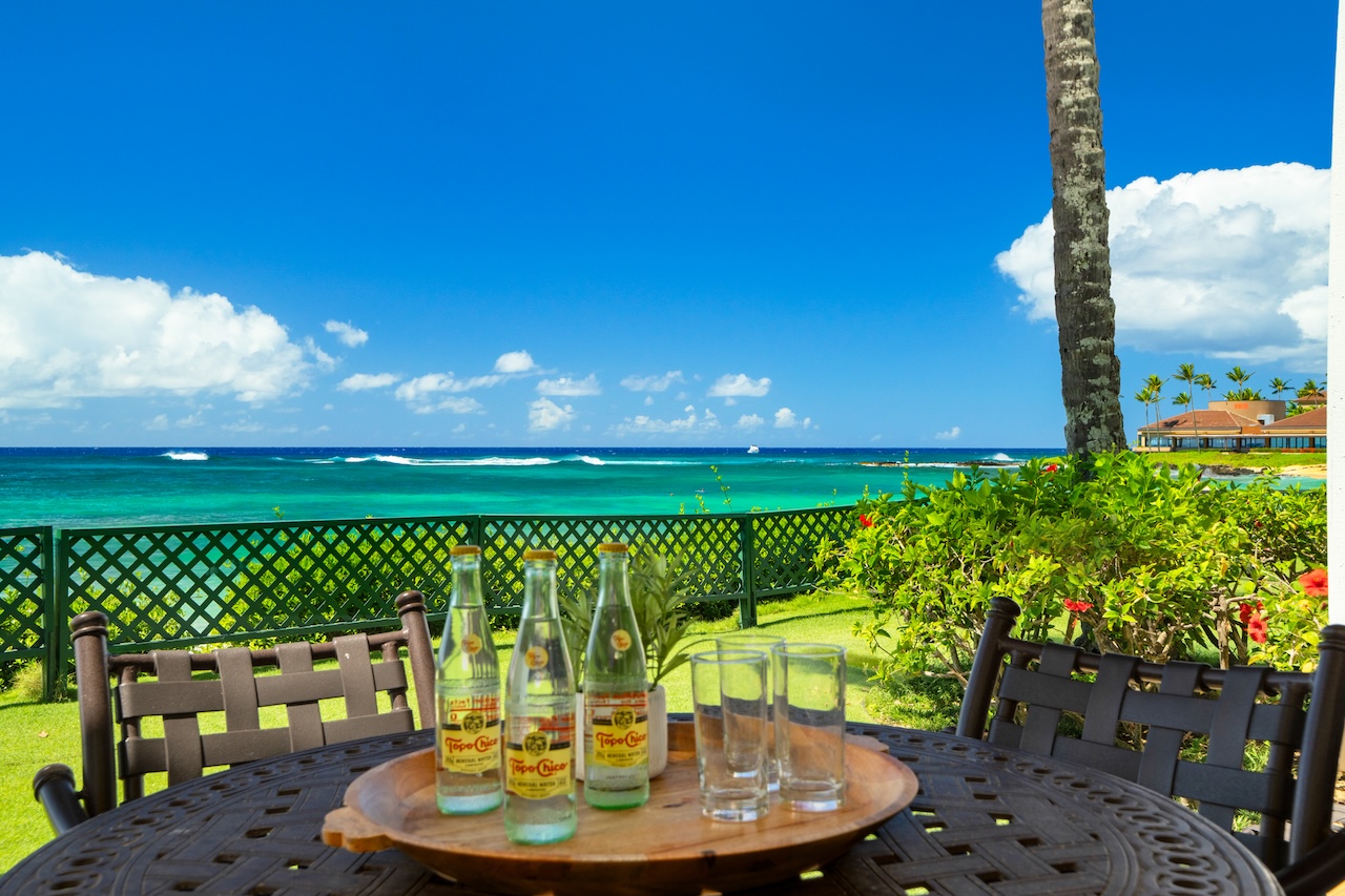 2253 Poipu Road, Unit 192 Koloa, HI 96756 - Photo 3 of 27 a view of a chairs and table in backyard