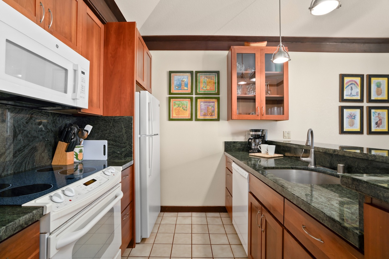 2253 Poipu Road, Unit 192 Koloa, HI 96756 - Photo 10 of 27 a kitchen with a sink and cabinets