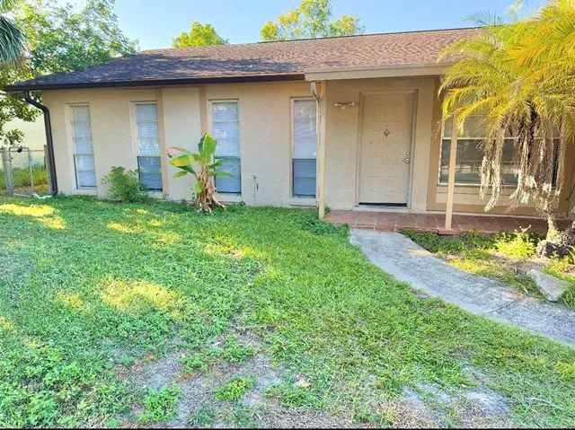 a view of a house with a yard and garage