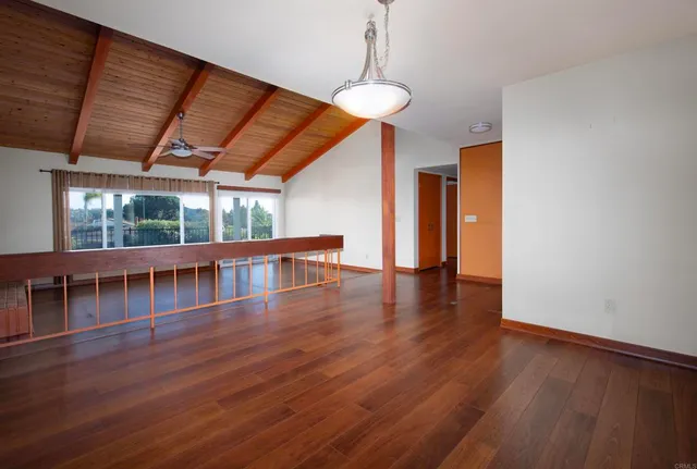 a view of a livingroom with wooden floor