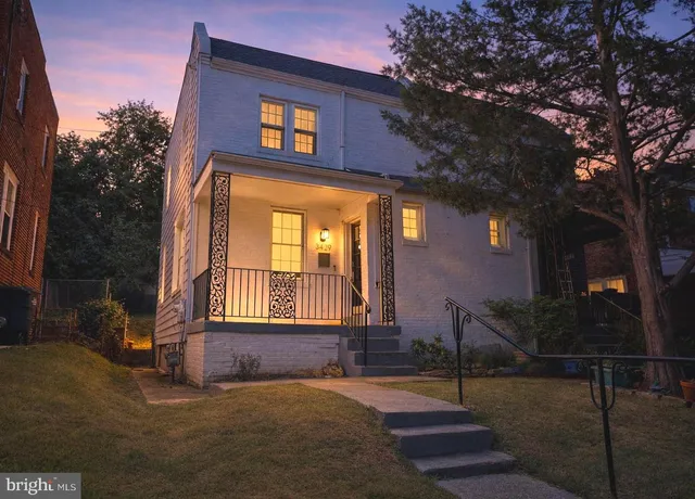 a front view of a house with parking