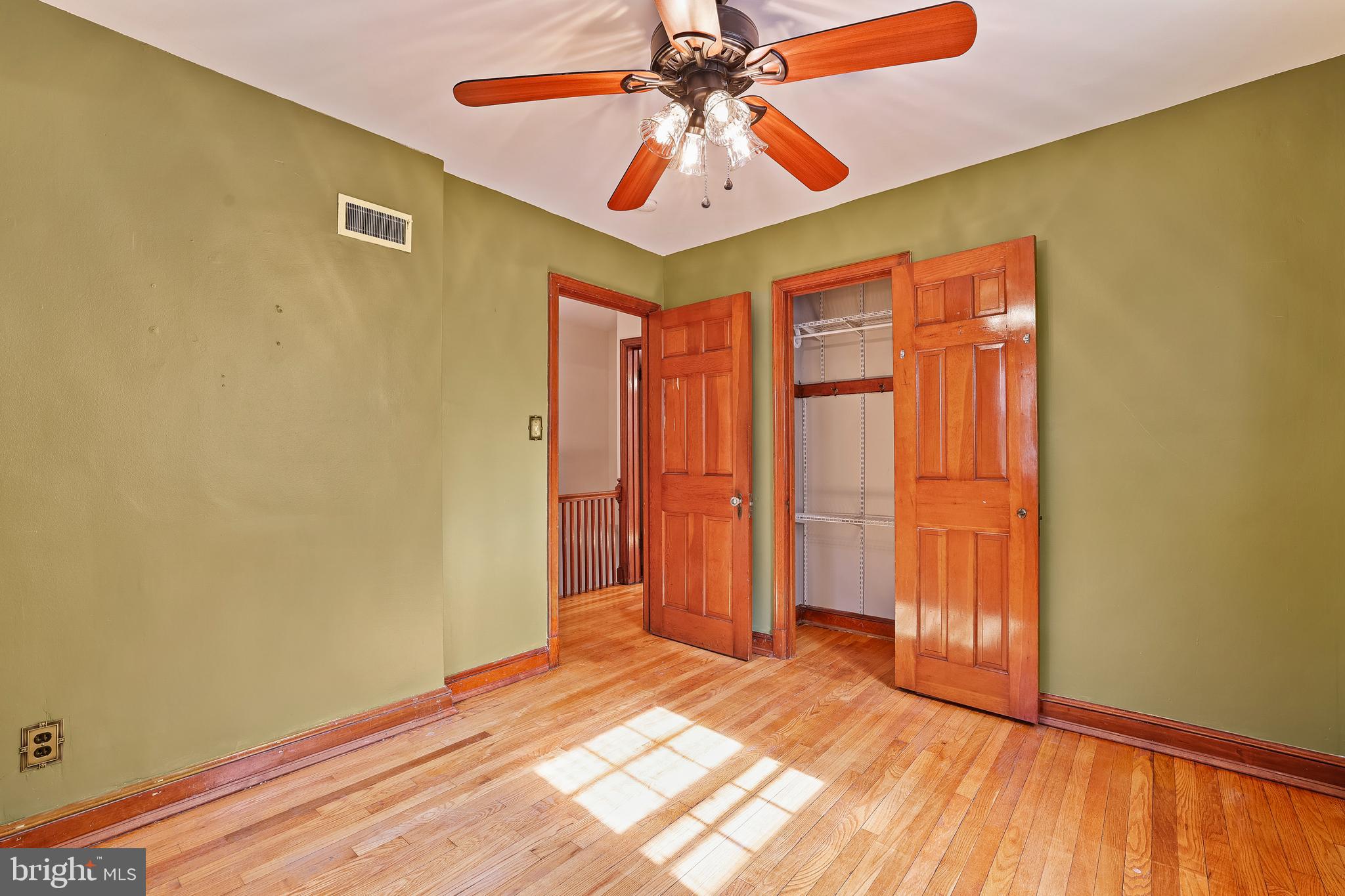 3429 Carpenter Street Southeast Washington, DC 20020 - Photo 14 of 27 an empty room with a window and chandelier fan