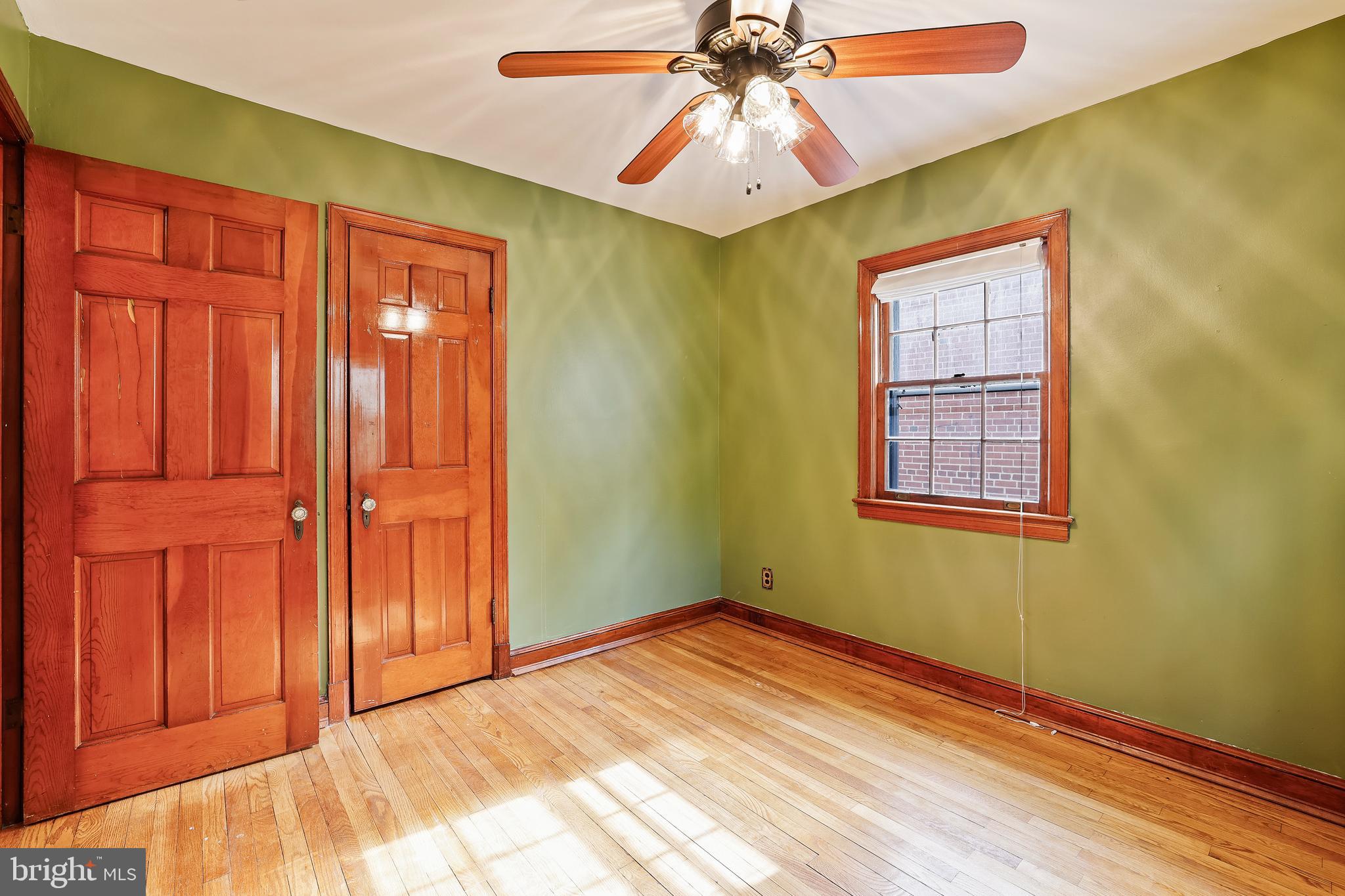 3429 Carpenter Street Southeast Washington, DC 20020 - Photo 15 of 27 an empty room with windows and fan