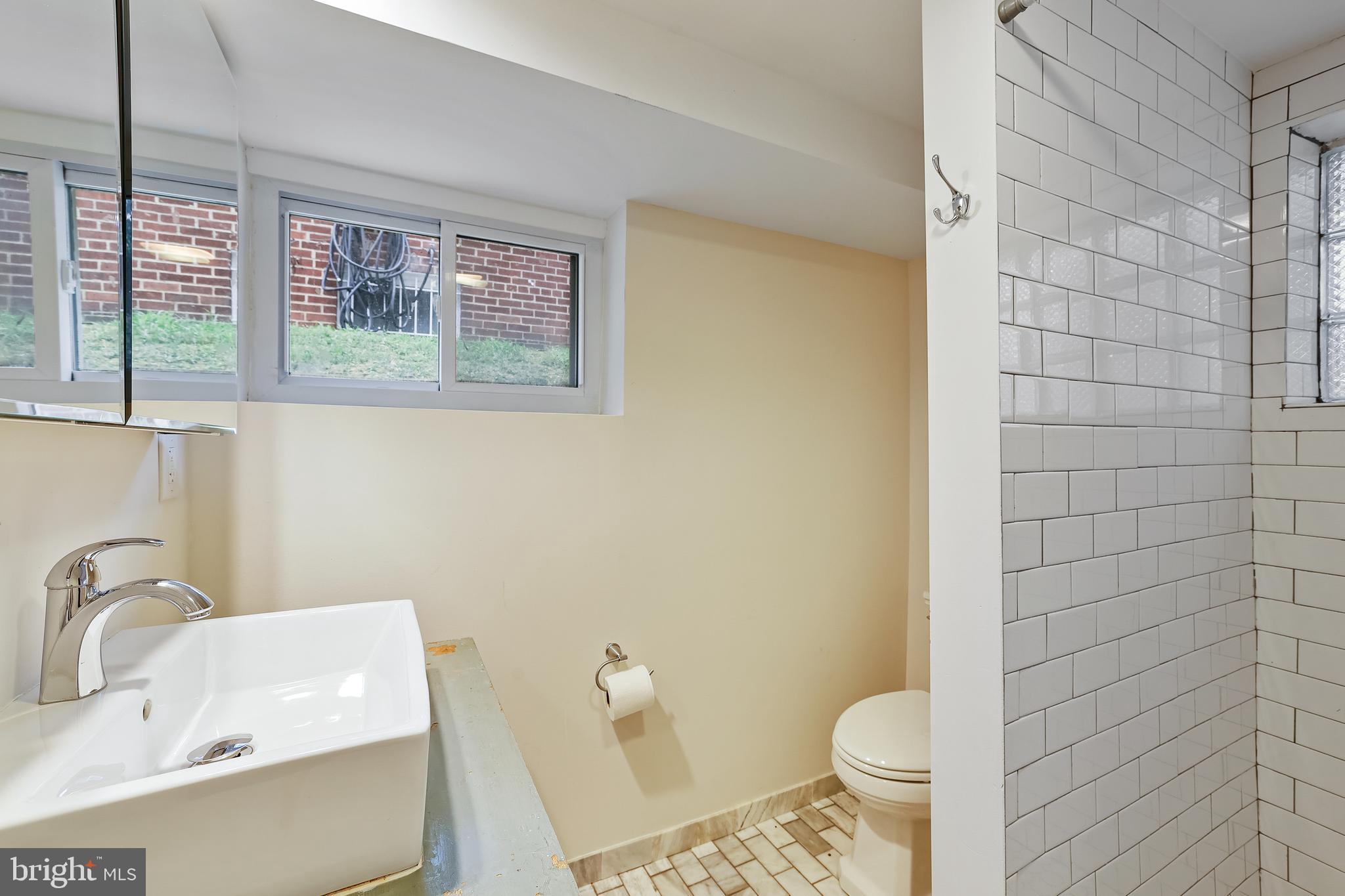 3429 Carpenter Street Southeast Washington, DC 20020 - Photo 18 of 27 a bathroom with a sink and a toilet