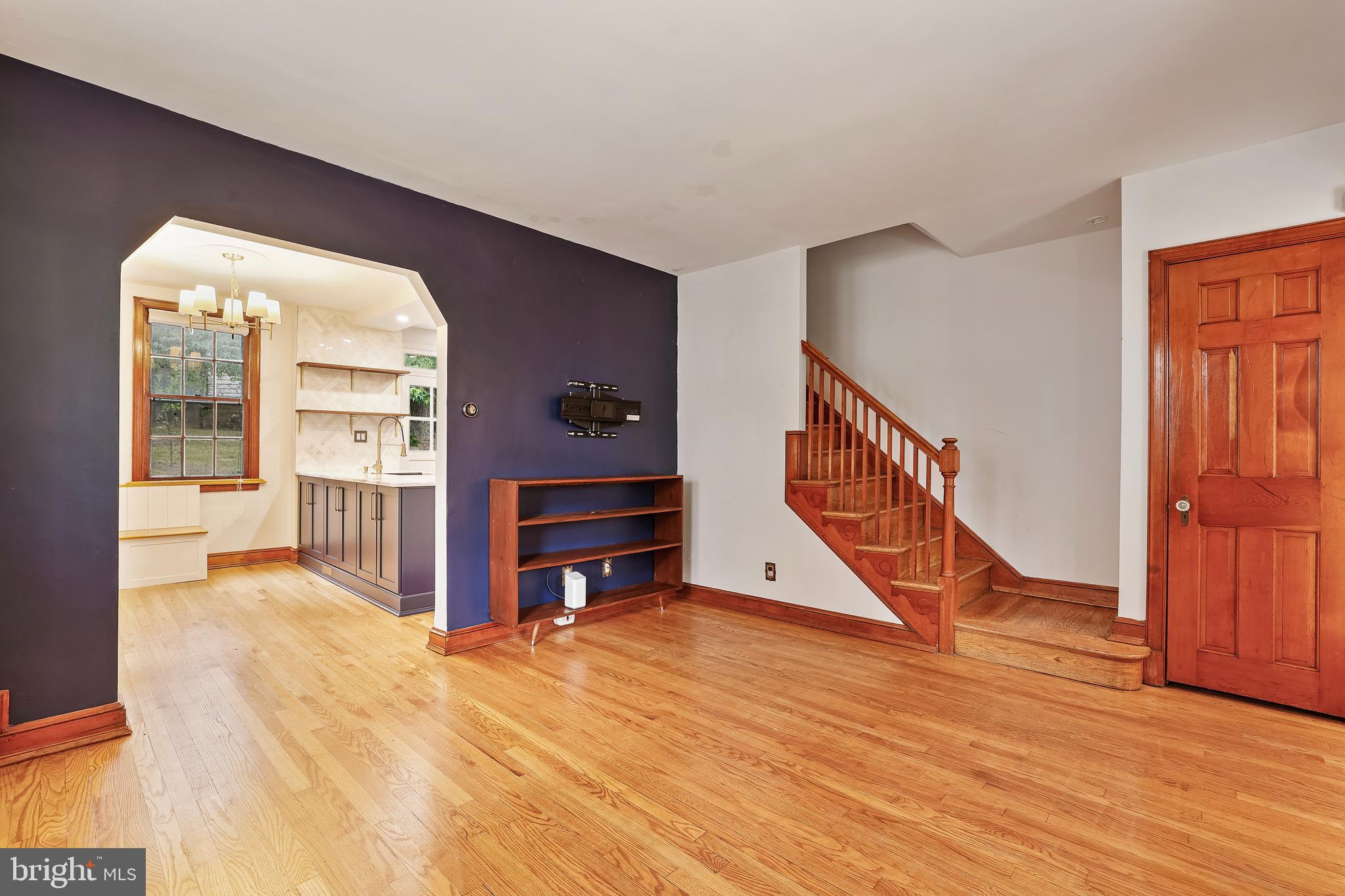 3429 Carpenter Street Southeast Washington, DC 20020 - Photo 2 of 27 a view of an empty room with wooden floor and a window