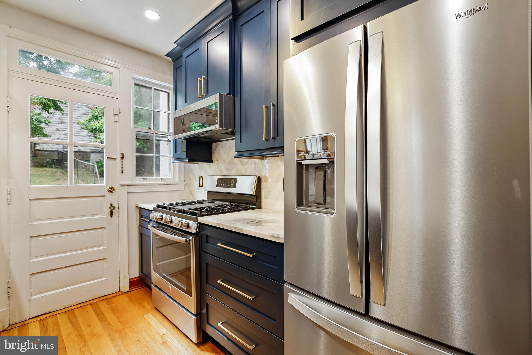 3429 Carpenter Street Southeast Washington, DC 20020 - Photo 8 of 27 a kitchen with stainless steel appliances granite countertop a refrigerator and a stove