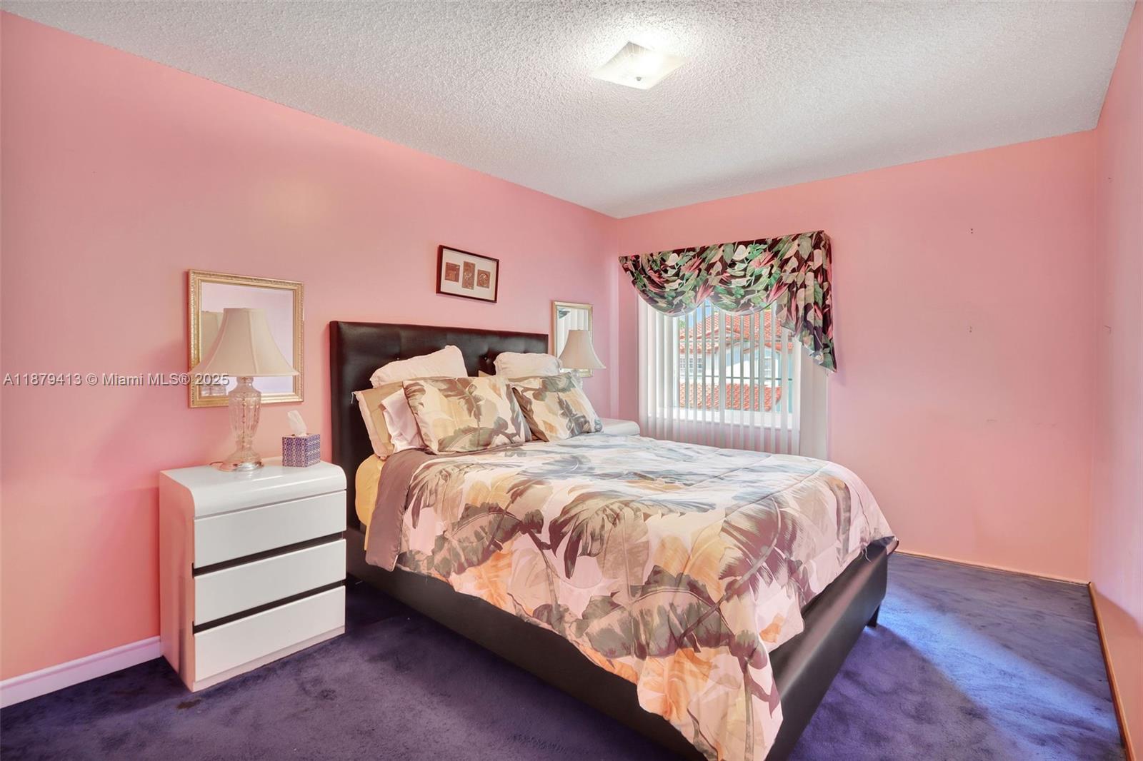 20717 Southwest 81st Place Cutler Bay, FL 33189 - Photo 12 of 23 a bedroom with a bed and a window