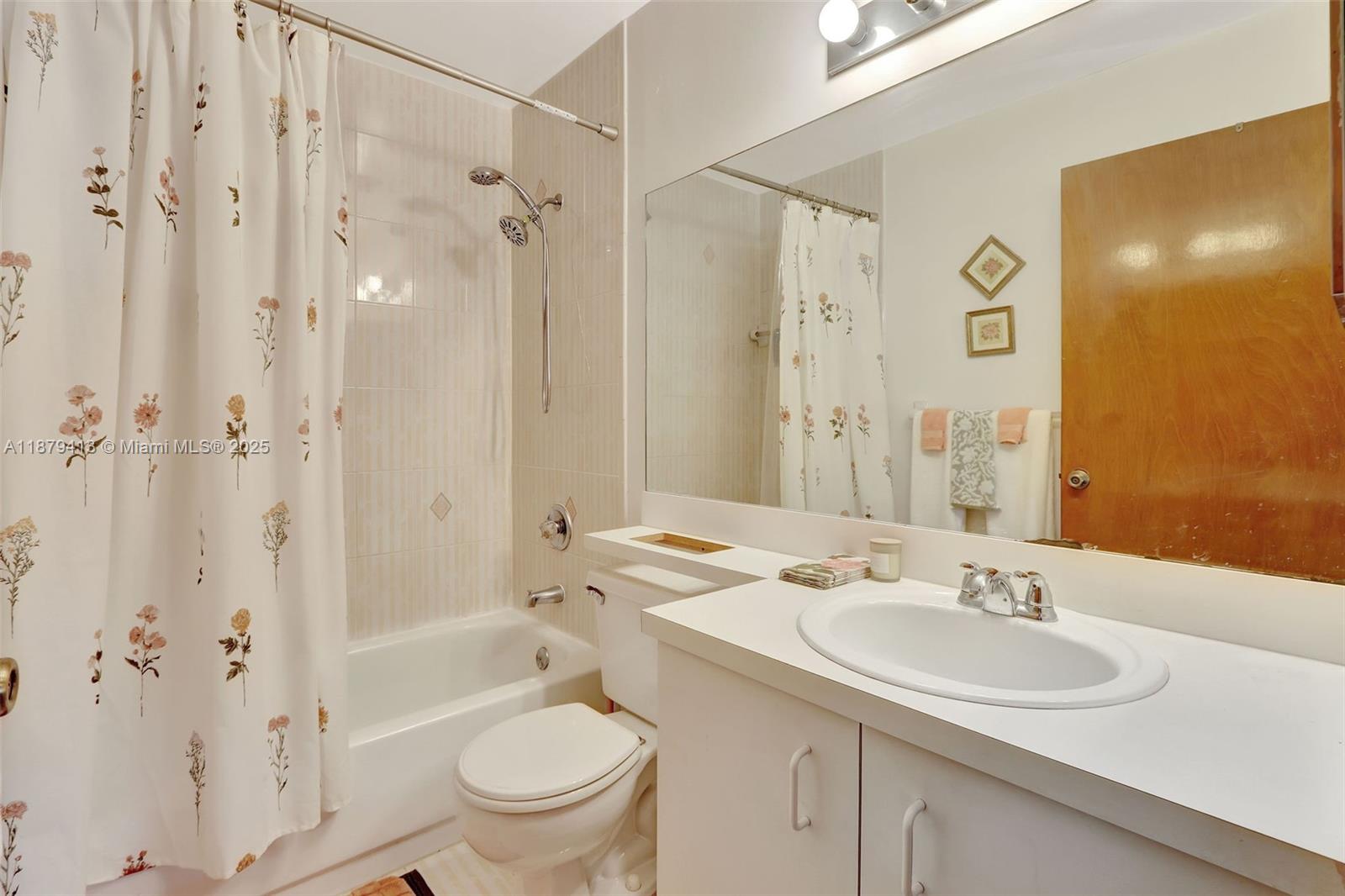 20717 Southwest 81st Place Cutler Bay, FL 33189 - Photo 14 of 23 a bathroom with a sink toilet double vanity and shower