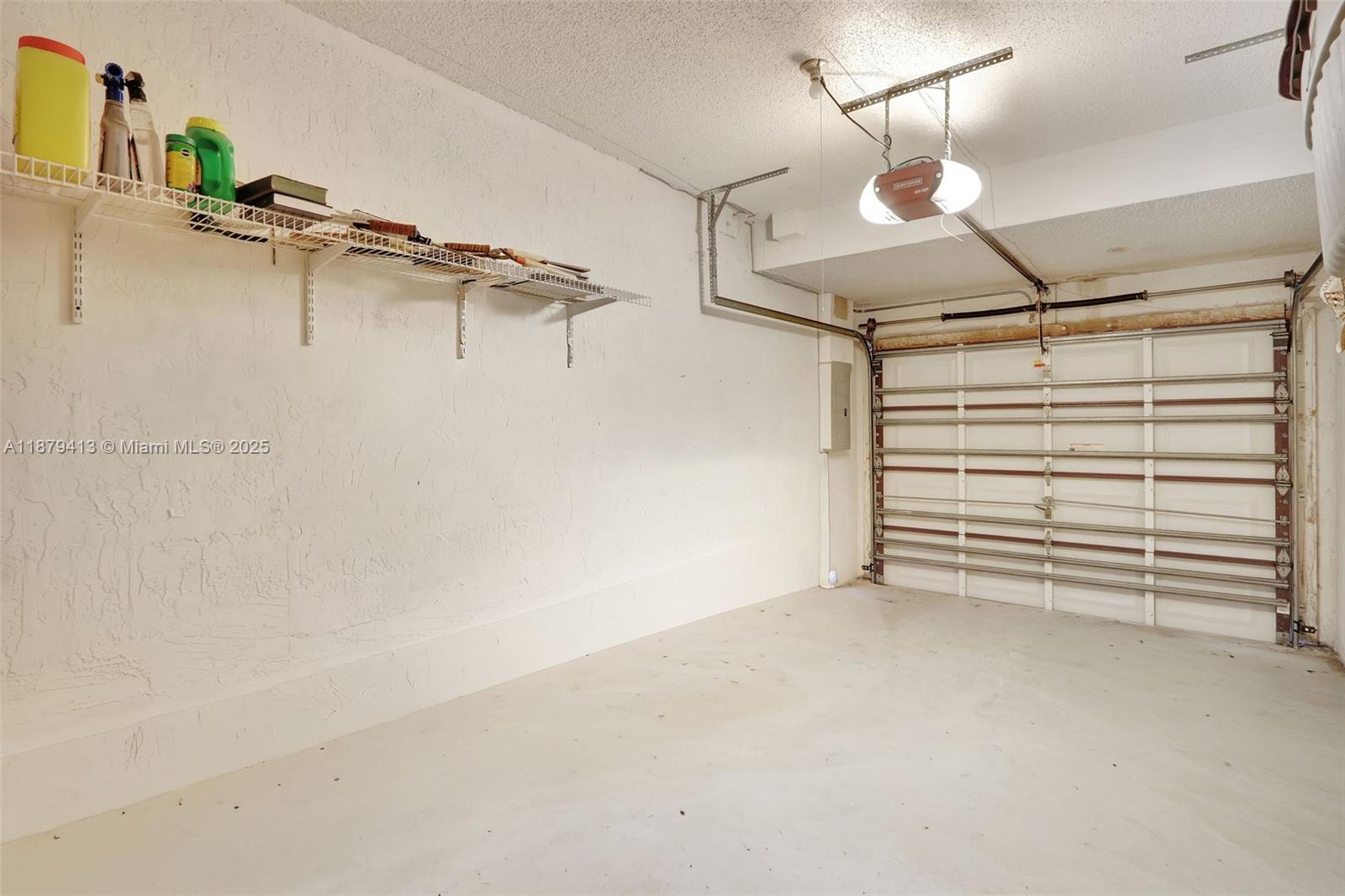 20717 Southwest 81st Place Cutler Bay, FL 33189 - Photo 20 of 23 a view of a room with racks on the wall