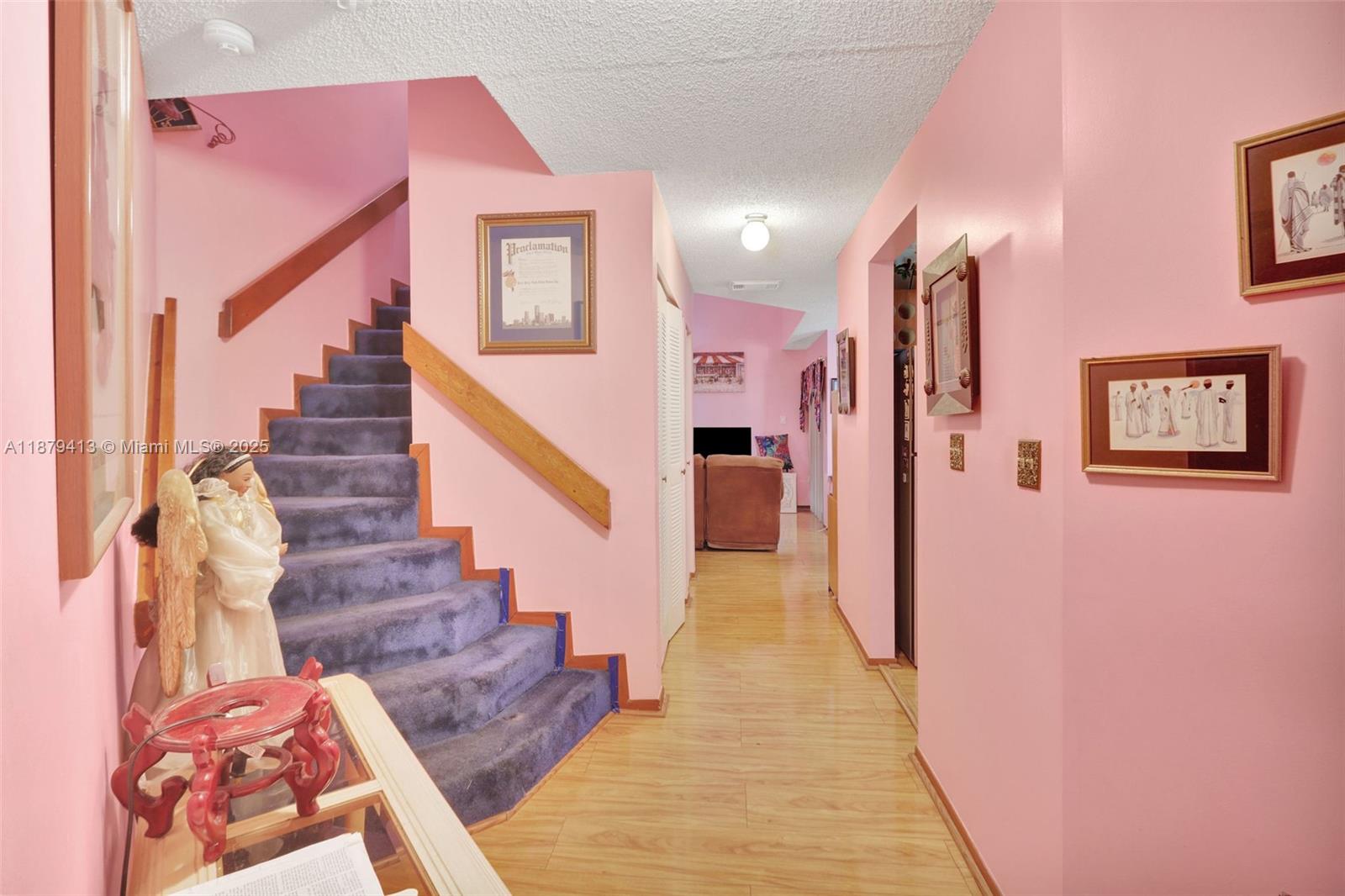 20717 Southwest 81st Place Cutler Bay, FL 33189 - Photo 2 of 23 a view of entryway and hall with wooden floor