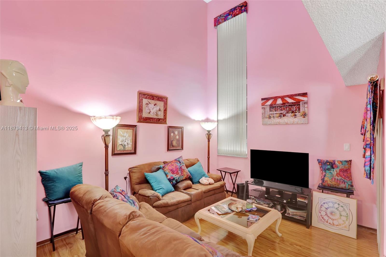 20717 Southwest 81st Place Cutler Bay, FL 33189 - Photo 4 of 23 a living room with furniture and a flat screen tv