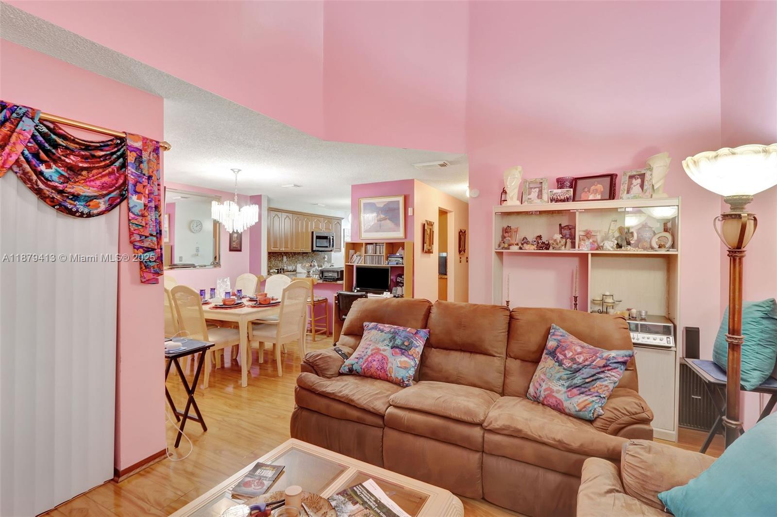 20717 Southwest 81st Place Cutler Bay, FL 33189 - Photo 5 of 23 a living room with furniture and a kitchen view