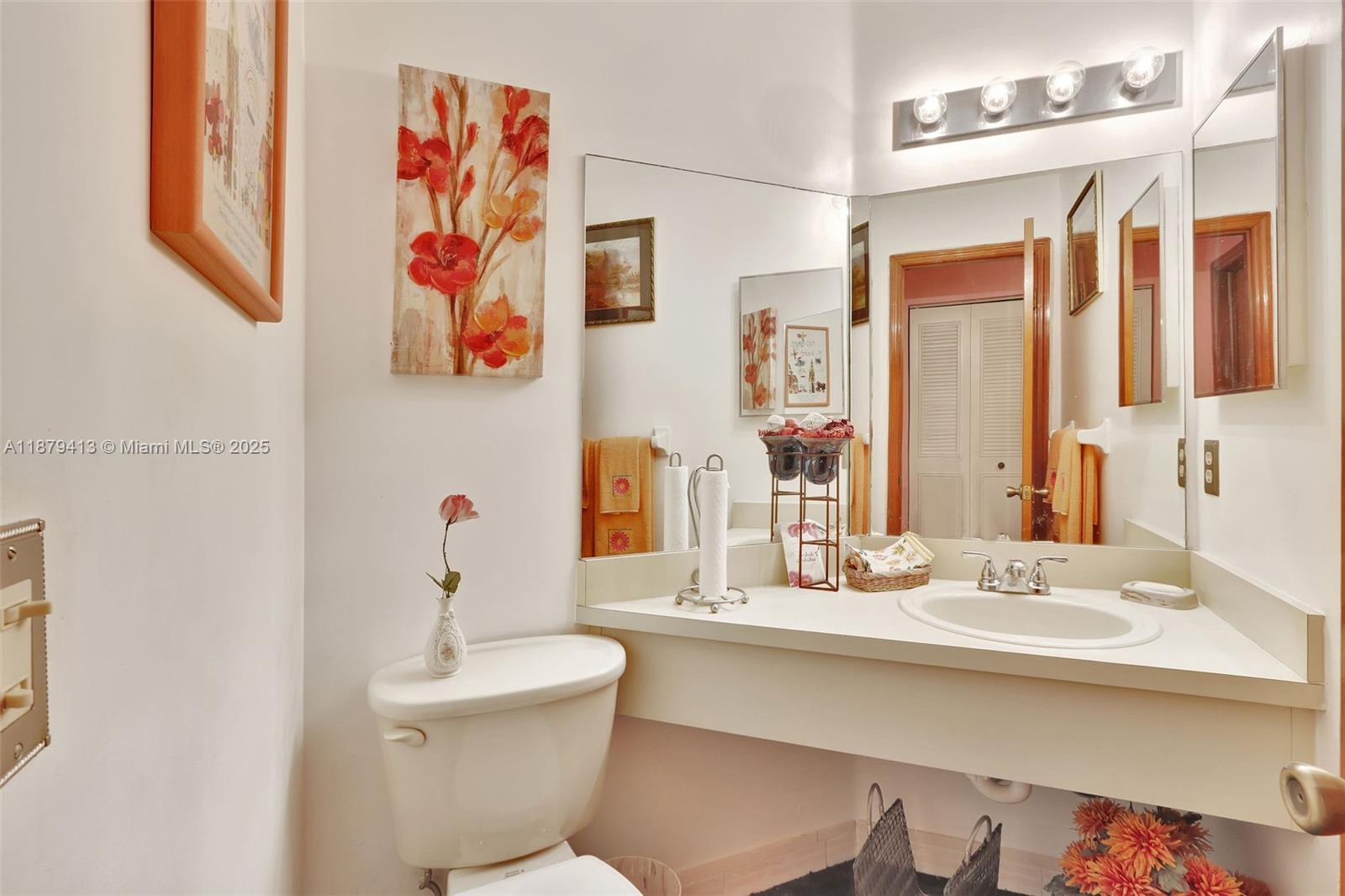 20717 Southwest 81st Place Cutler Bay, FL 33189 - Photo 8 of 23 a bathroom with a sink and a mirror