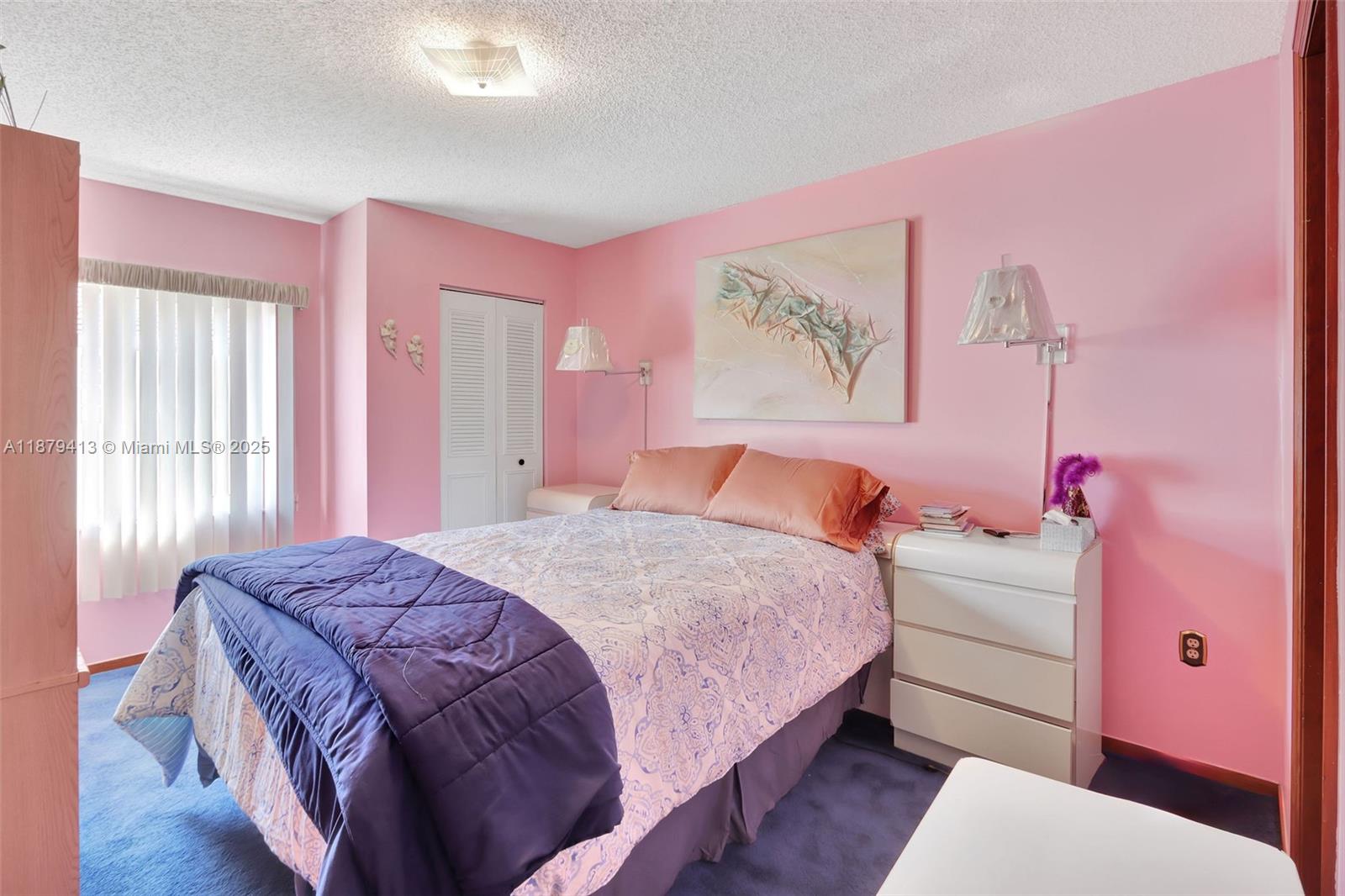 20717 Southwest 81st Place Cutler Bay, FL 33189 - Photo 9 of 23 a bedroom with a bed and a couch