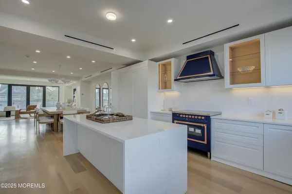 a kitchen with stainless steel appliances granite countertop a stove and a sink