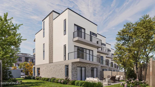 a front view of a building with garden