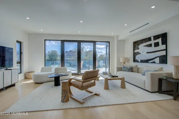 a living room with furniture and large window