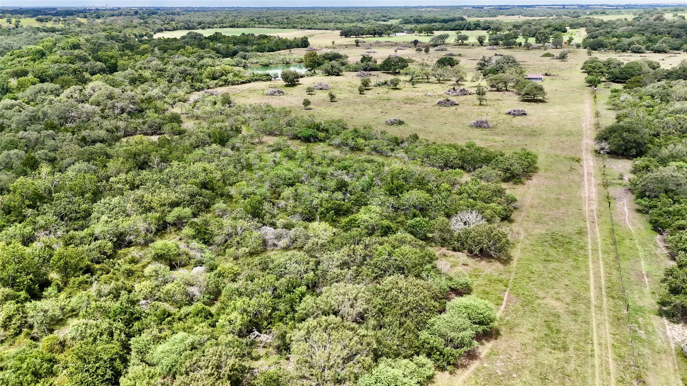 312 County Road 312 Yoakum, TX 77995 - Photo 21 of 28 an aerial view of residential houses with outdoor space and trees