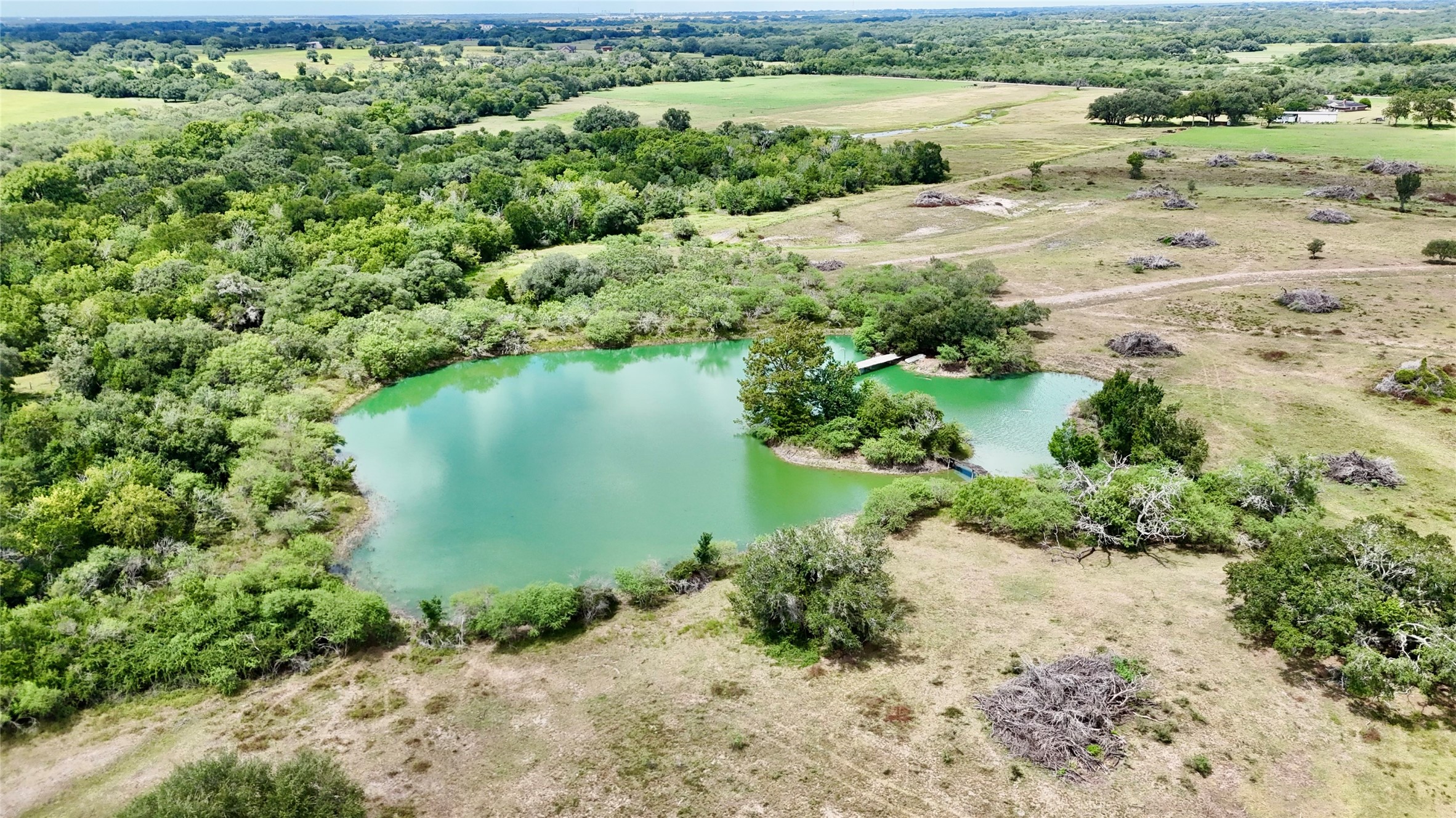 312 County Road 312 Yoakum, TX 77995 - Photo 23 of 28 a view of a lake with beach and green space
