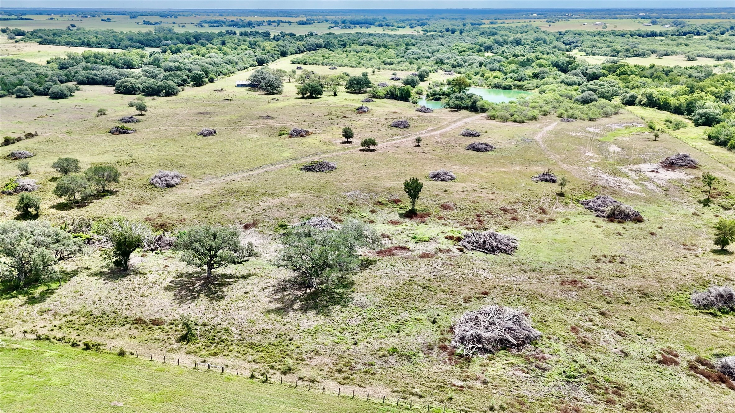 312 County Road 312 Yoakum, TX 77995 - Photo 26 of 28 a view of a dry yard with wooden fence