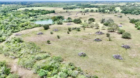 a view of a large yard with lots of green space