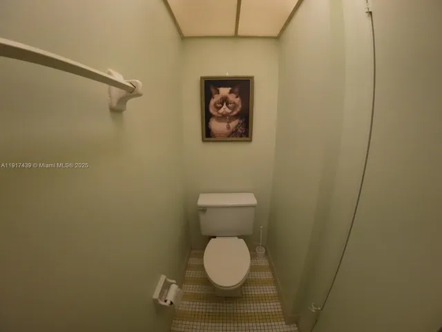 a bathroom with a toilet and a vanity