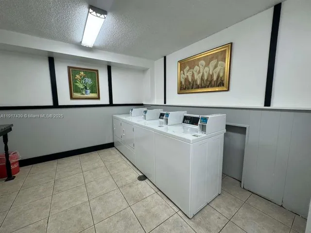 a utility room with washer and dryer