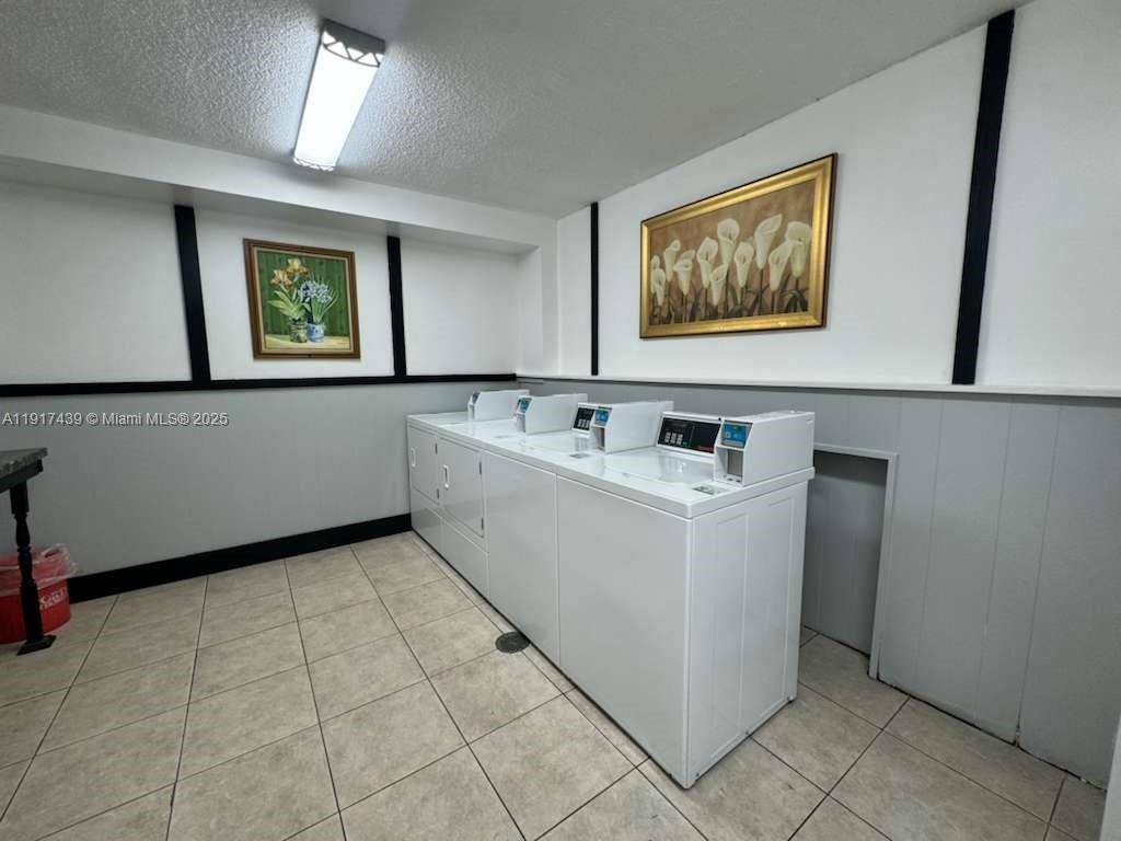 3730 Inverrary Drive, Unit 3U Lauderhill, FL 33319 - Photo 18 of 37 a utility room with washer and dryer