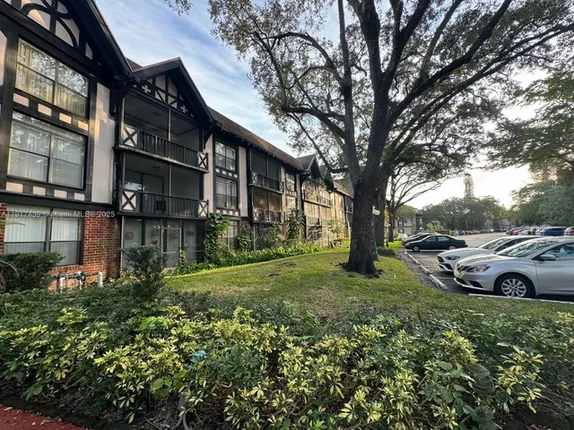 a view of a garden with large tree