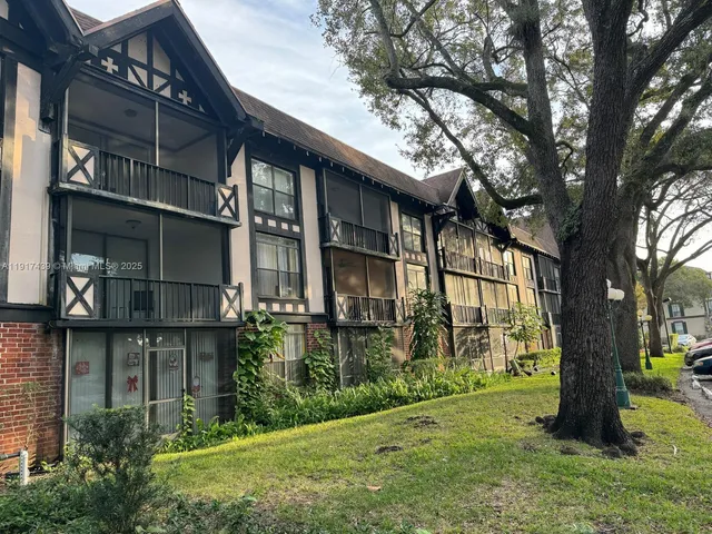 a living room with furniture rug and wooden floor