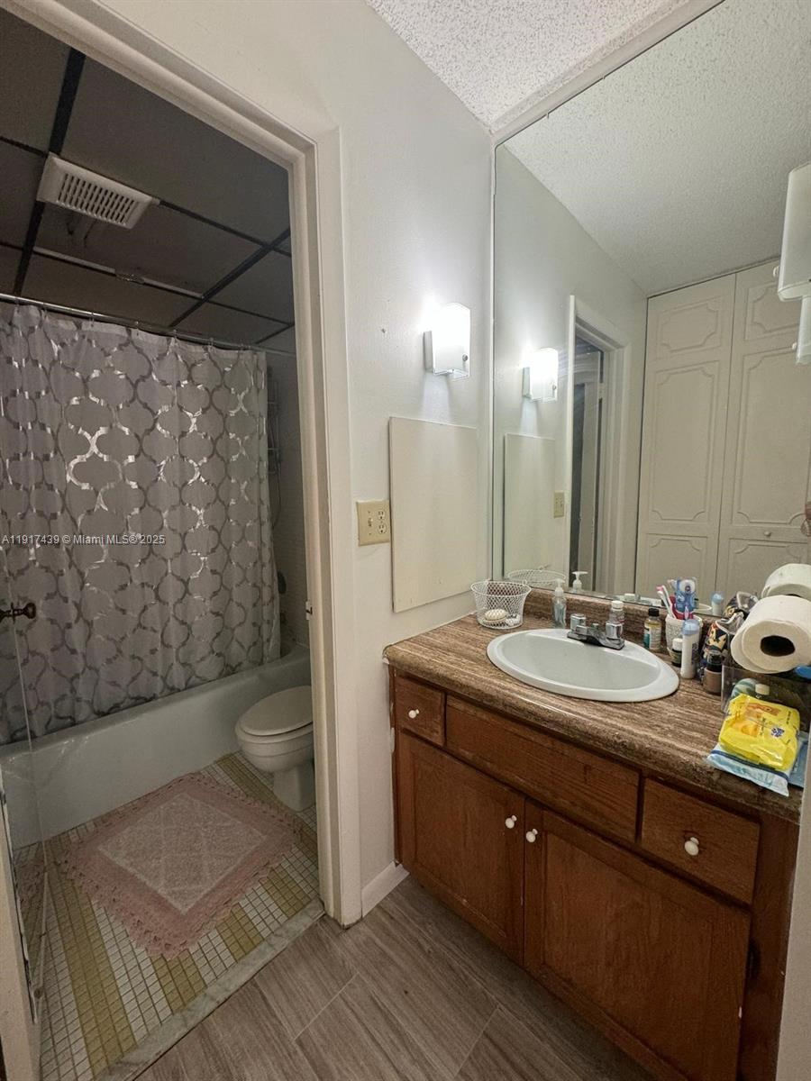 3730 Inverrary Drive, Unit 3U Lauderhill, FL 33319 - Photo 10 of 37 a bathroom with a double vanity sink toilet and shower
