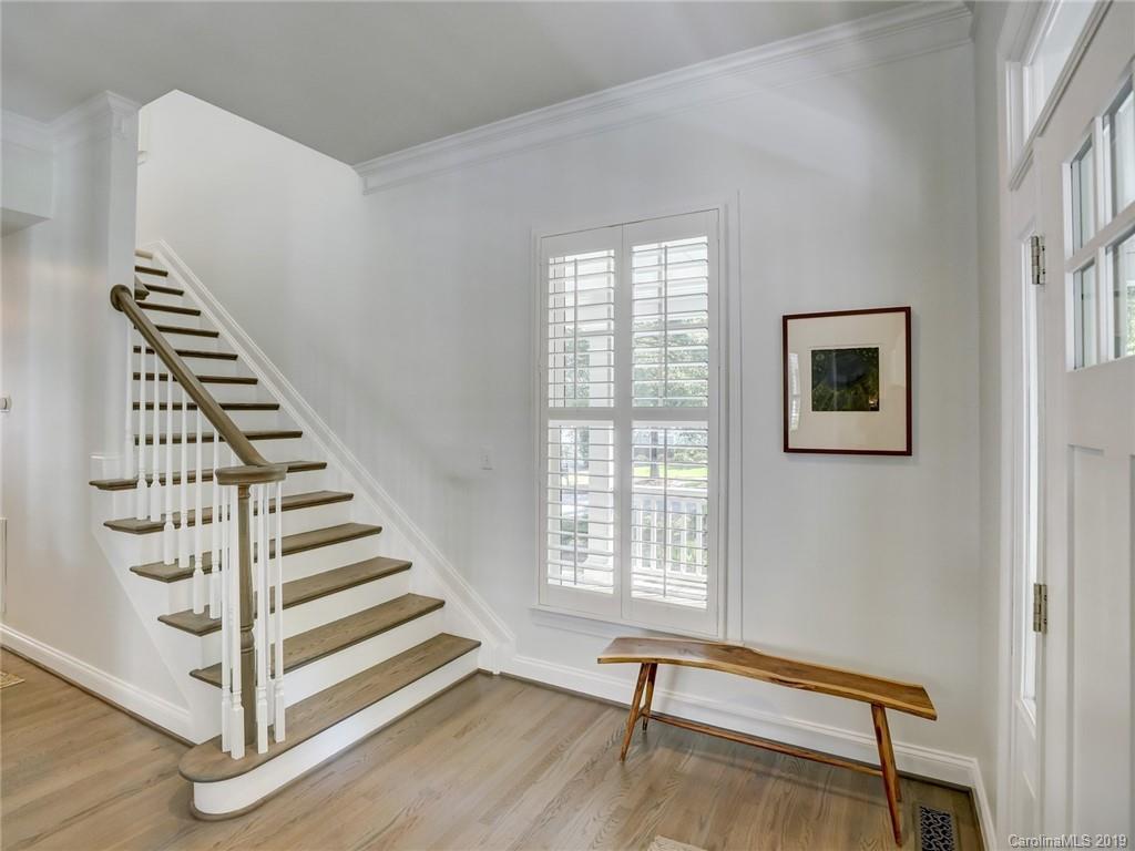 2533 Lower Assembly Drive Fort Mill, SC 29708 - Photo 11 of 48 a view of entryway with stairs and wooden floor