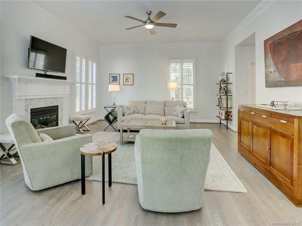 2533 Lower Assembly Drive Fort Mill, SC 29708 - Photo 21 of 48 a living room with furniture a fireplace and a flat screen tv
