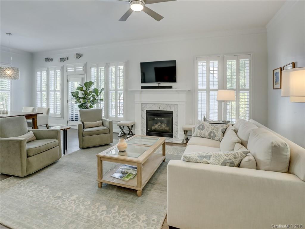 2533 Lower Assembly Drive Fort Mill, SC 29708 - Photo 23 of 48 a living room with furniture a fireplace and a flat screen tv