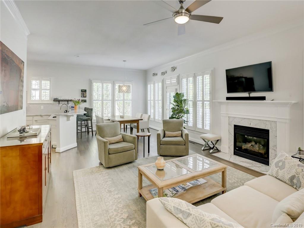 2533 Lower Assembly Drive Fort Mill, SC 29708 - Photo 25 of 48 a living room with furniture a fireplace and a flat screen tv