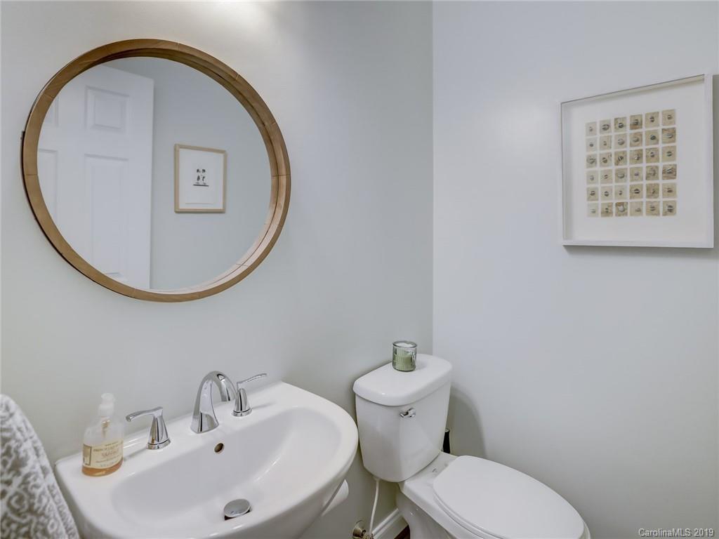 2533 Lower Assembly Drive Fort Mill, SC 29708 - Photo 26 of 48 a bathroom with a toilet a sink and a mirror