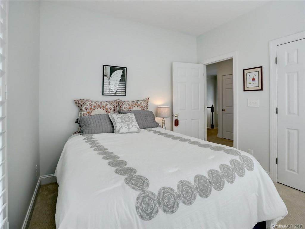 2533 Lower Assembly Drive Fort Mill, SC 29708 - Photo 32 of 48 a bedroom with a bed and painting on the wall